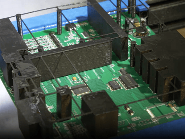 DIVSYS can provide PCB coating as part of Indianapolis PCB Manufacturing image shows closeup of circuit board