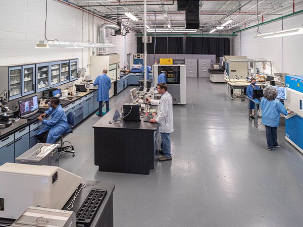 Utilize comprehensive testing and Indianapolis PCB Manufacturing from DIVSYS image shows team at work in lab
