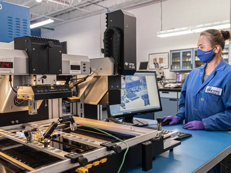 DIVSYS can provide BGA repair for Indianapolis PCB Manufacturing image shows female technician working in lab