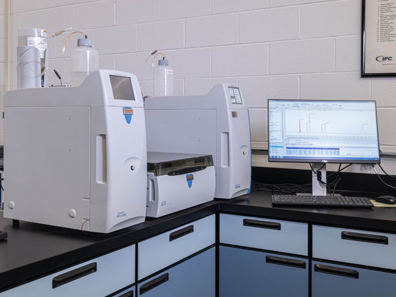 DIVSYS has a quality lab testing setup for the Indianapolis PCBA Manufacturing process image shows machine and monitor at work station