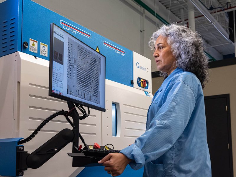 DIVSYS can provide x-ray inspection during the Indianapolis PCB Manufacturing process image shows technician studying contents of screen