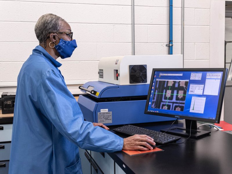 DIVSYS can complete X-ray fluorescence testing during Indianapolis PCB Manufacturing image shows technician at work station
